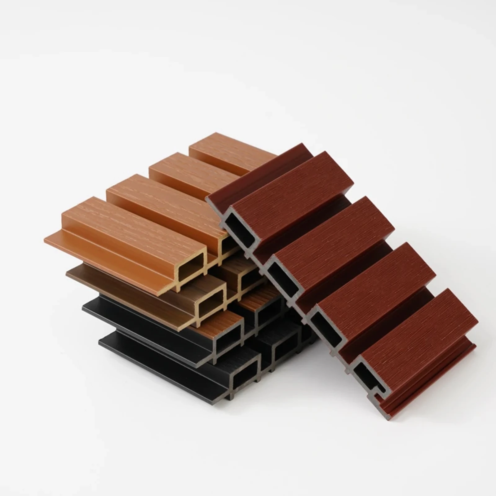 Product photograph of fluted WPC samples with hollow cores and wood-grain faces